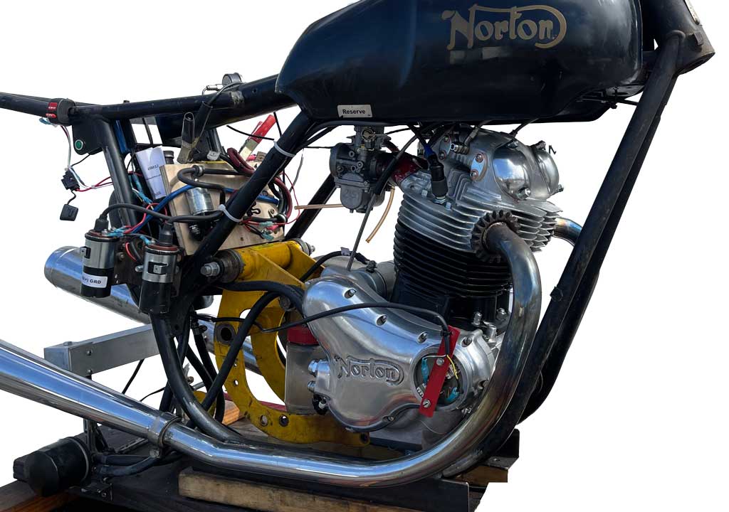 Norton motorcycle engine mounted in a test stand for repair at Classic Bike Experience in Essex, Vermont