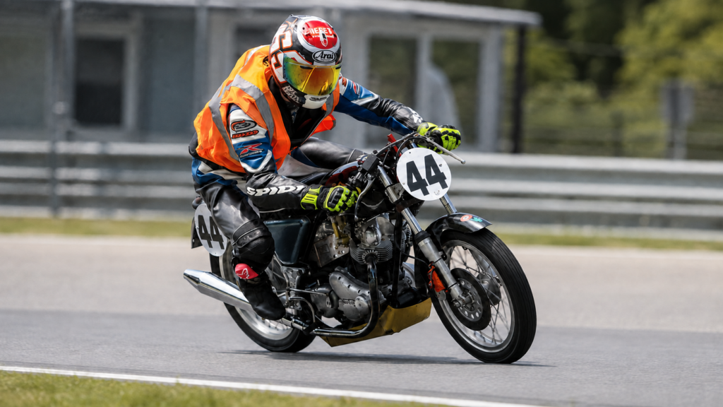 Griffin Smith, a former Classic Bike Experience intern racing the number 44 CBE Norton Commando at Canaan Motor Club